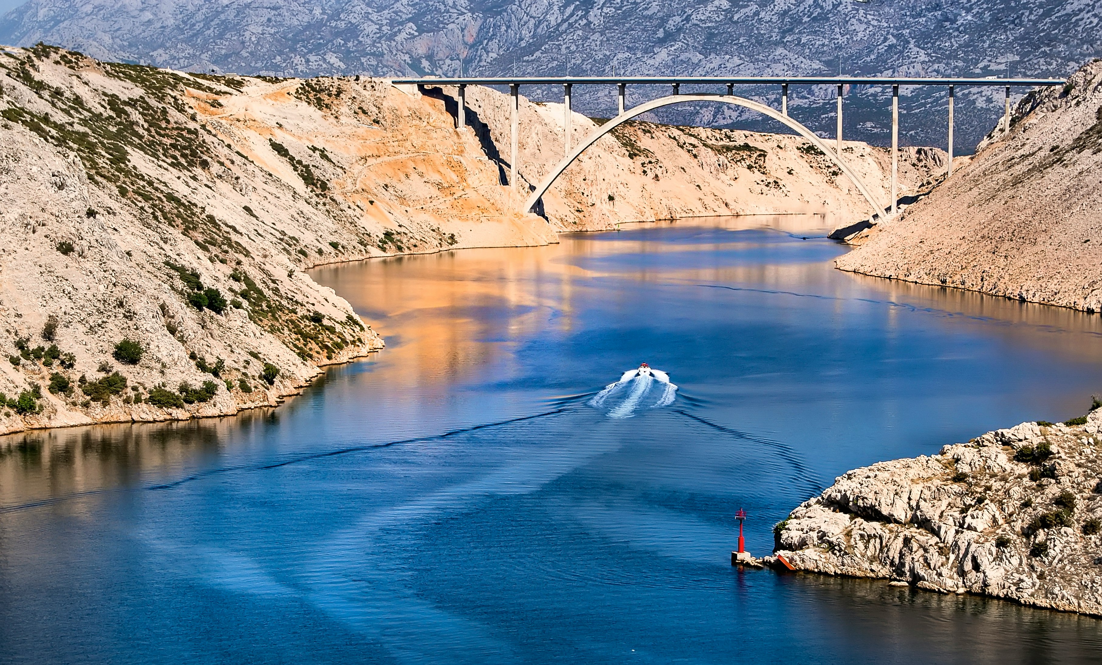 body of water between cliff